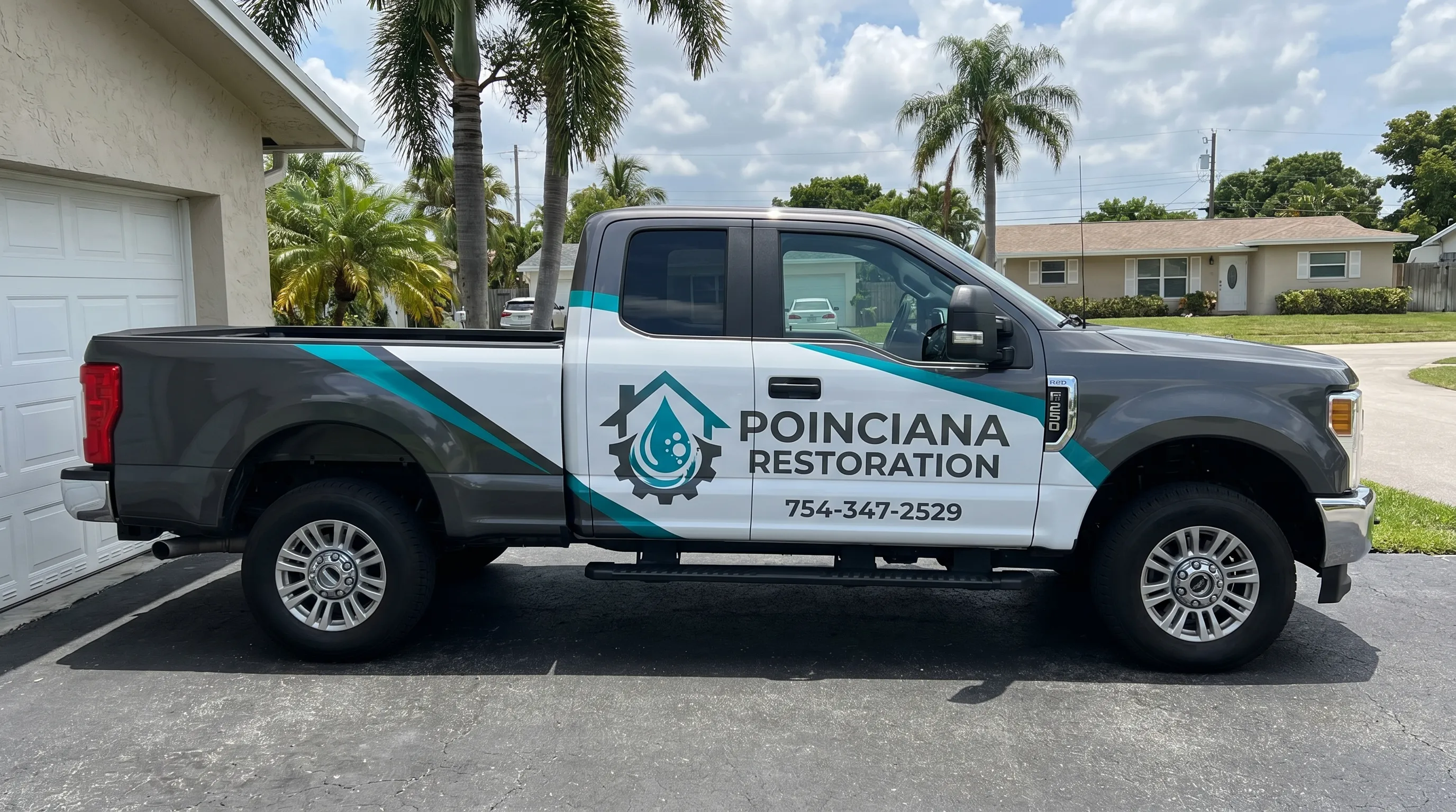 Poinciana Restoration crew performing water damage restoration at a Hollywood, FL property